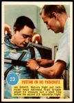 #23 Putting on his parachute Gus Grissom 