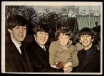 #29 Paul, John and Ringo with young boy  
